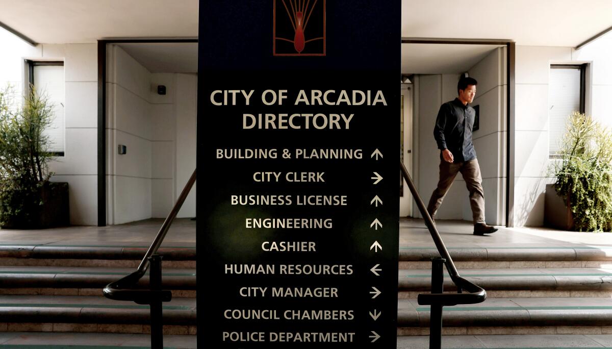 A man exits Arcadia City Hall