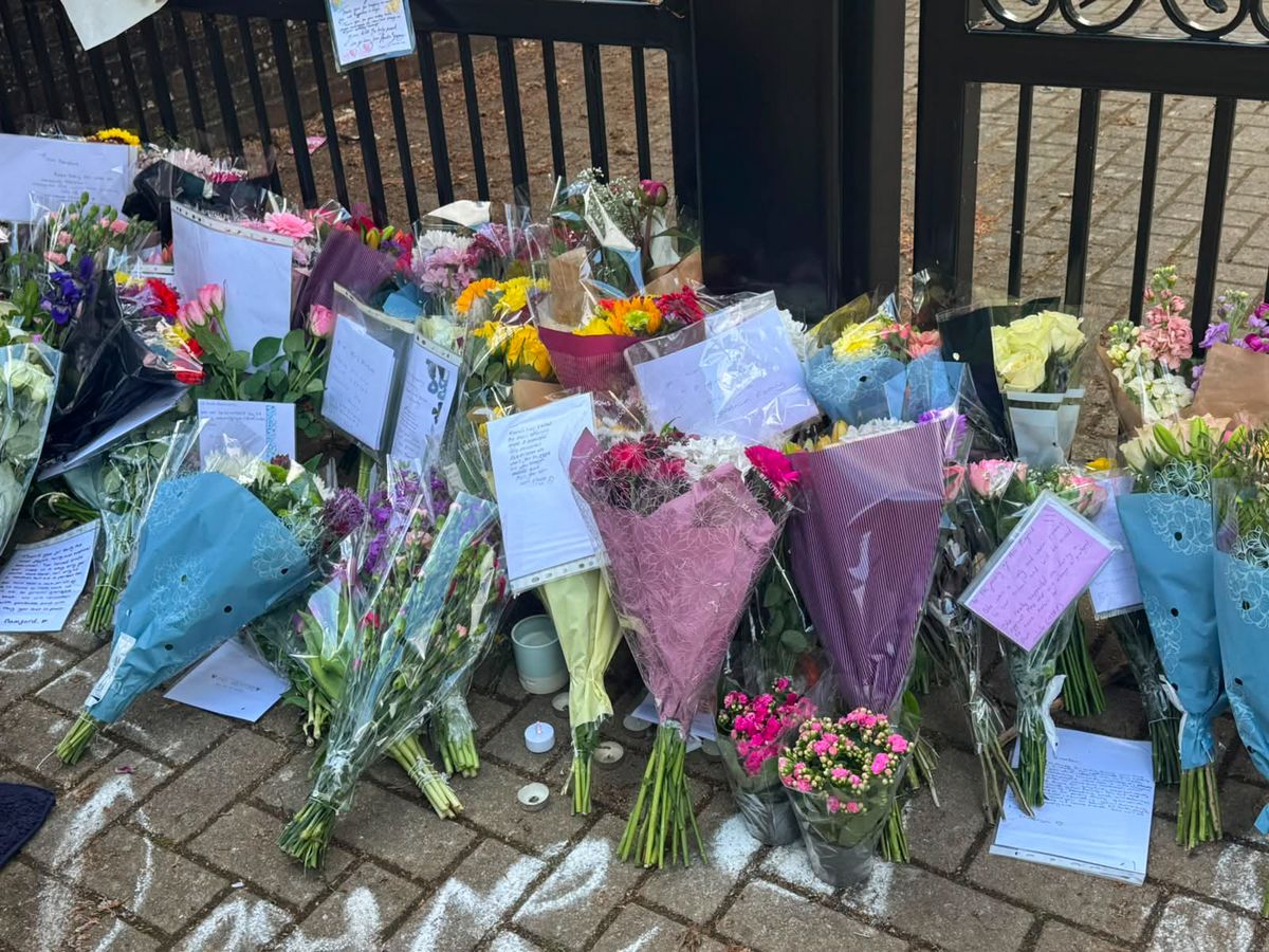 A photo of flowers outside the gates