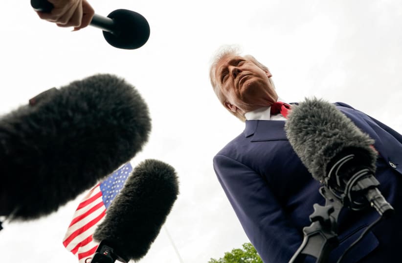 US President Donald Trump listens to reporters at the White House in Washington, DC, US, May 8, 2026.