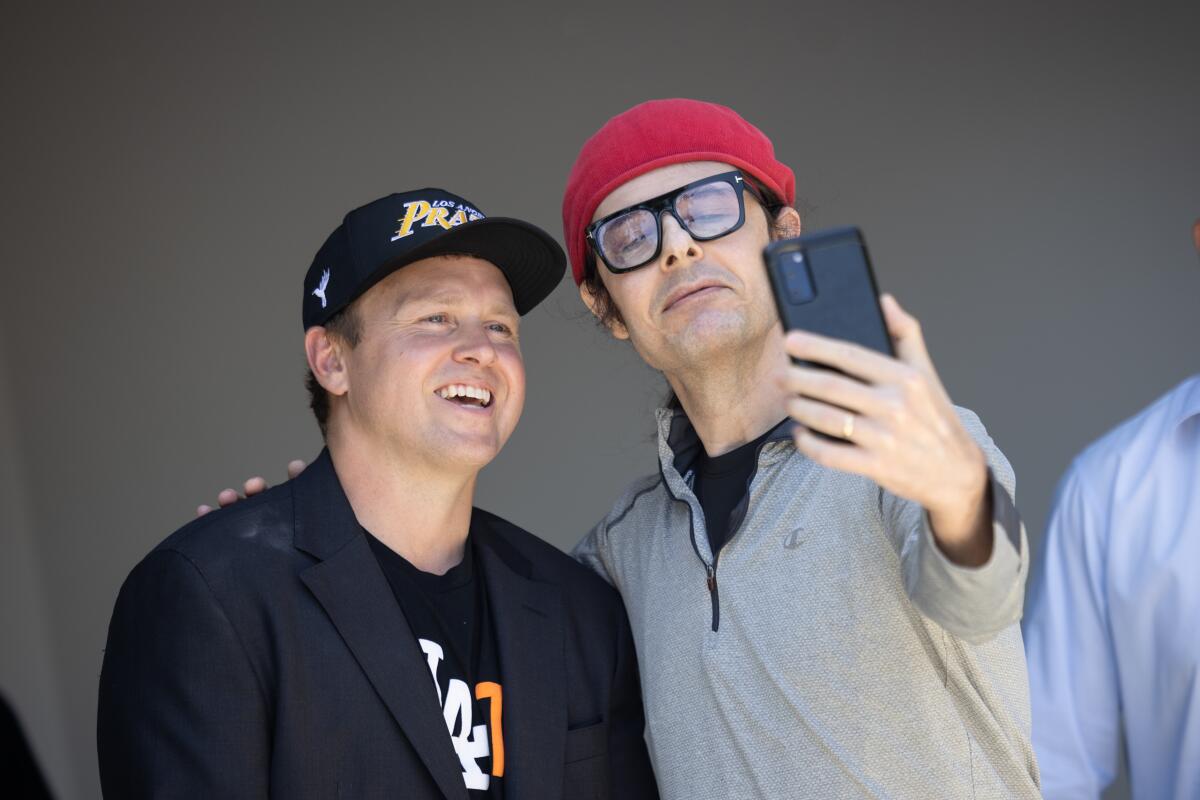 Spencer Pratt, left, poses with a supporter taking a selfie.