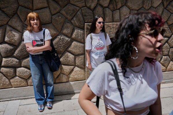 Protesters chant pro-Palestinian slogans outside Greece's Foreign Ministry after Israel's navy intercepted an activist flotilla in waters off of Cyprus, in Athens, Tuesday, May 19, 2026. (AP Photo/Thanassis Stavrakis)