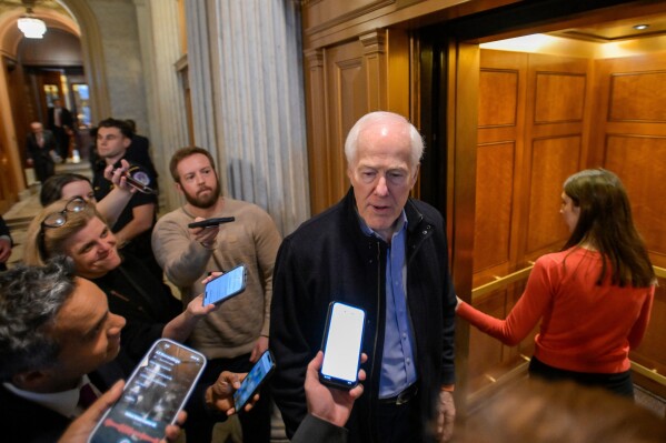Sen. John Cornyn, R-Texas, talks with reporters as he leaves the Senate chamber during a Senate war powers vote on Capitol Hill, March 4, 2026, in Washington. (AP Photo/Rod Lamkey, Jr., File)