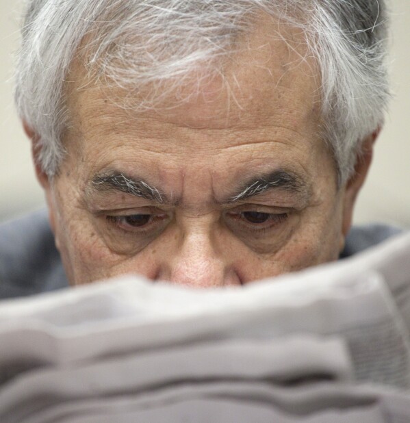 Rep. Barney Frank, D-Mass., ranking Democrat on the House Financial Services Committee, looks over papers on Capitol Hill in Washington, Jan. 25, 2011, prior to a news conference. (AP Photo/Harry Hamburg, File)