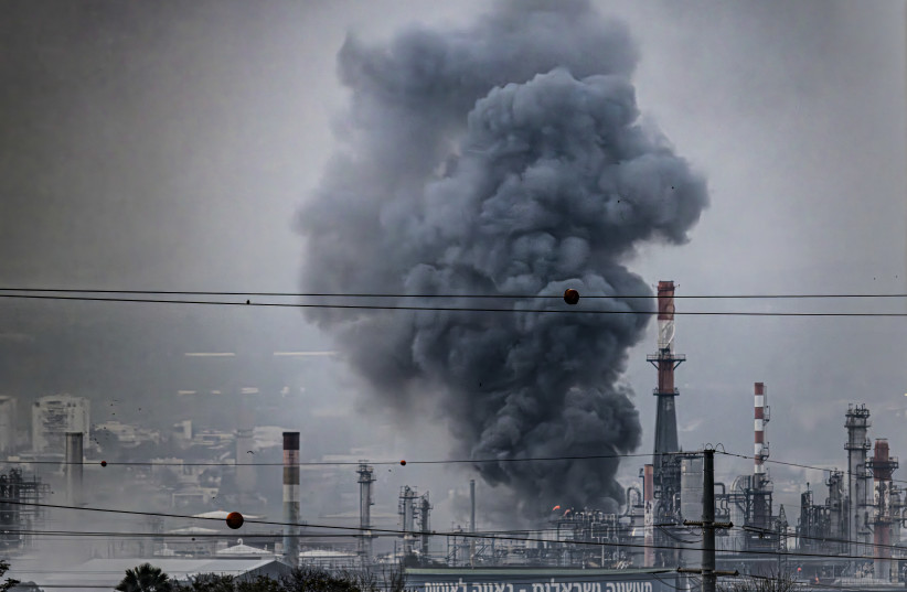 Smoke rises from the oil refineries in Haifa, northern Israel, following a missile strike fired from Iran toward Israel, in March.
