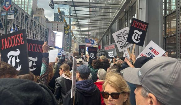 Protestors outside the New York Times headquarters on Thursday.