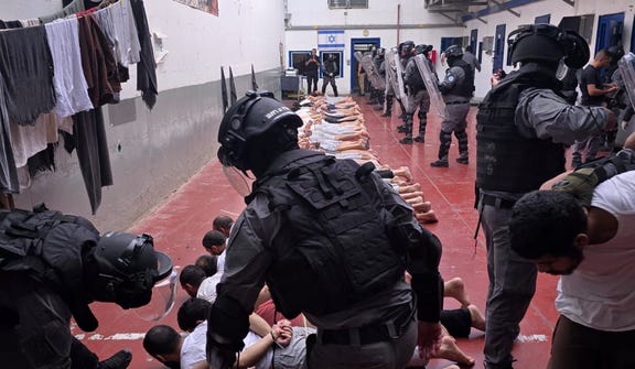 Israeli guards who were filmed abusing Palestinian detainees at Megiddo Prison in northern Israel in 2024.