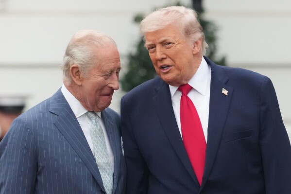President Donald Trump and Britain's King Charles III talk on stage during a State Visit arrival ceremony on the South Lawn of the White House, on April 28, 2026, in Washington. (AP Photo/Alex Brandon, File)