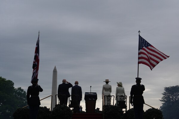 President Donald Trump, from left, King Charles III, first lady Melania Trump and Queen Camilla stand for the national anthems of their respective countries during an arrival ceremony among others on the South Lawn of the White House, on April 28, 2026, in Washington. (AP Photo/Julia Demaree Nikhinson, File)