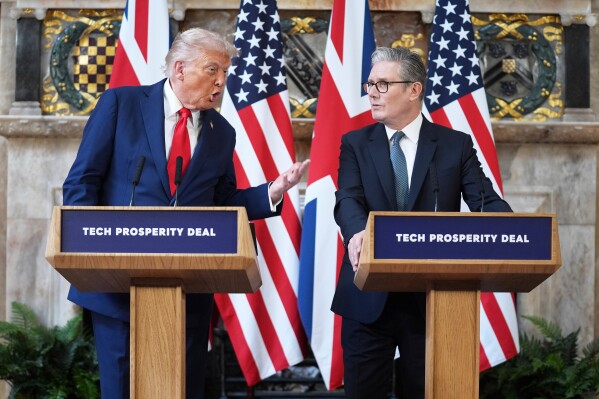 President Donald Trump gestures next to Britain's Prime Minister Keir Starmer during a joint press conference at Chequers near Aylesbury, England, on Sept. 18, 2025. (AP Photo/Evan Vucci, File)