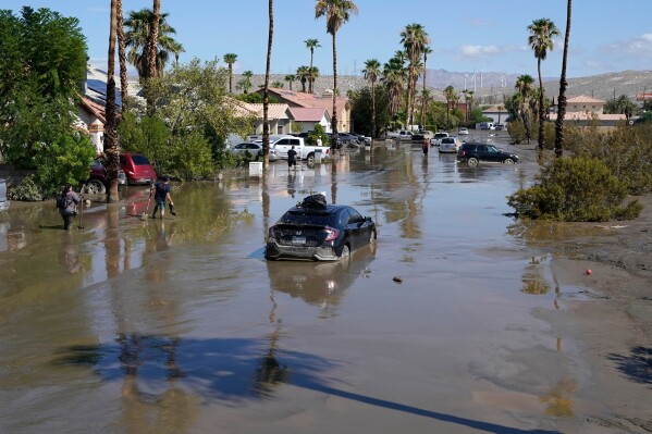 Cars are seen stuck in the mud following Tropical Storm Hilary on a street Aug. 21, 2023, in Cathedral City, Calif. (AP Photo/Mark J. Terrill, File)