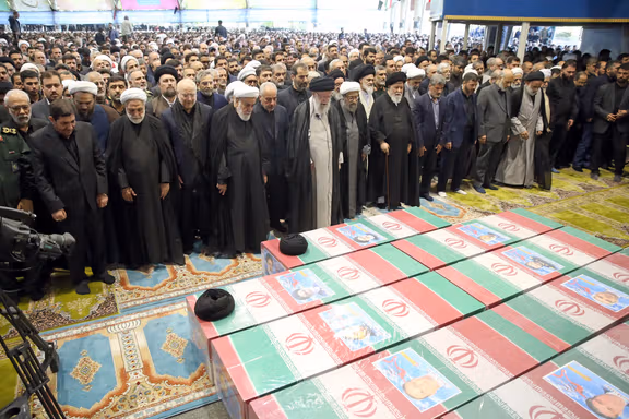 Former Supreme Leader Ali Khamenei leading a prayer at the coffin of Ebrahim Raisi and other officials killed in the crash (May 2024)