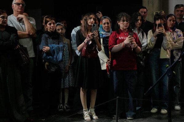People watch a music performance dubbed "Sounds of the South," featuring music from southern Iran, at the Tehran Museum of Contemporary Art in Tehran, Iran, Thursday, May 21, 2026. (AP Photo/Vahid Salemi)