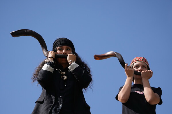 Musicians play kudu horns during a performance dubbed "Sounds of the South," featuring music from southern Iran, at the Tehran Museum of Contemporary Art in Tehran, Iran, Thursday, May 21, 2026. (AP Photo/Vahid Salemi)