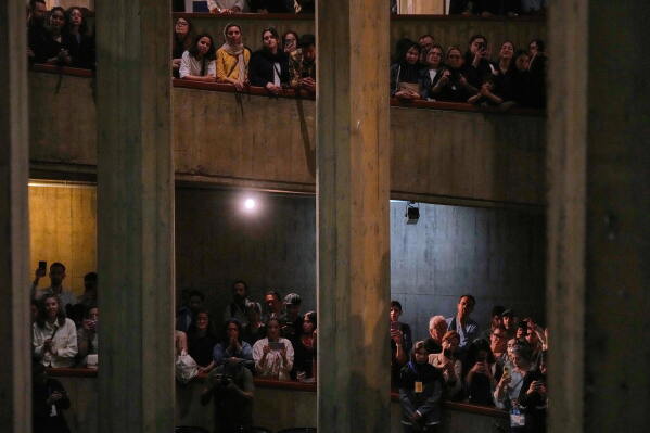 People watch a music performance dubbed "Sounds of the South," featuring music from southern Iran, at the Tehran Museum of Contemporary Art in Tehran, Iran, Thursday, May 21, 2026. (AP Photo/Vahid Salemi)