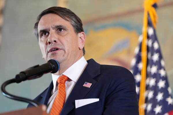 Acting Attorney General Todd Blanche answers questions at an event where federal prosecutors announced charges against former Cuban President Raul Castro in the 1996 downing of civilian planes operated by Miami-based exiles, Wednesday, May 20, 2026, in Miami. (AP Photo/Rebecca Blackwell)