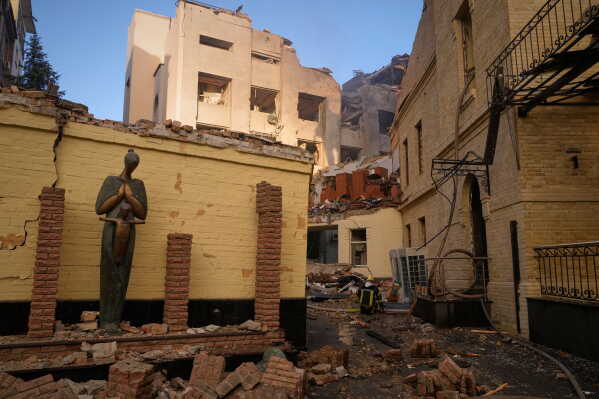 Firefighters work on the scene of a damaged building of the Museum of Chernobyl after a Russian missile attack in Kyiv, Ukraine, Sunday, May 24, 2026. (AP Photo/Efrem Lukatsky)