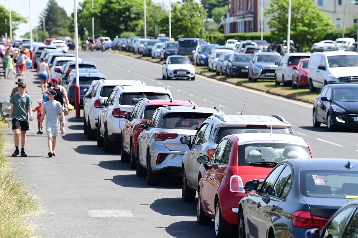 Cars parked on the pavement with no parking on Ainsdale beach