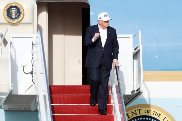President Donald Trump walks down the stairs of Air Force One upon his arrival at Joint Base Andrews, Md., Friday, Nov. 15, 2026. (AP Photo/Luis M. Alvarez)