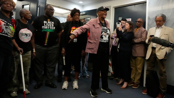 Demonstrators protest in the Senate hallway in response to HB1 and SB1, redistricting bills, during a special session of the Alabama Legislature, Wednesday, May 6, 2026, in Montgomery, Ala. (AP Photo/Mike Stewart)
