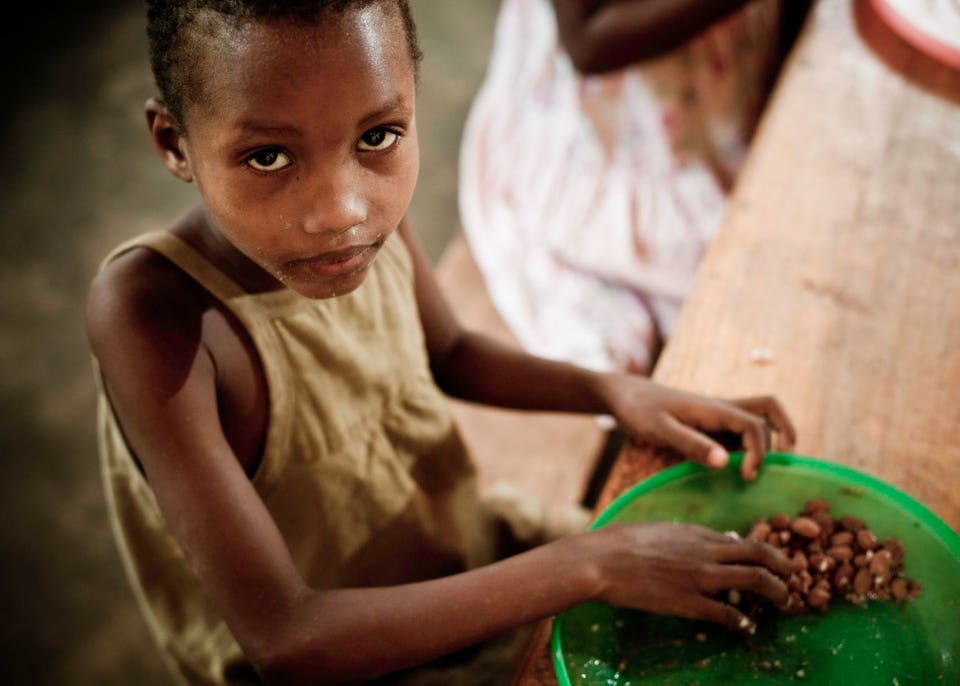 African Girl Eating a Meal in the Orphanage
