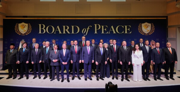 President Donald Trump stands with other World leaders before a Board of Peace meeting at the U.S. Institute of Peace, Feb. 19, 2026, in Washington. (AP Photo/Mark Schiefelbein, File)