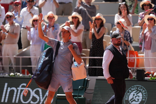 Jannik Sinner of Italy waves as he leaves the court after the second round men's singles tennis match against Juan Manuel Cerundolo of Argentina at the French Open tennis tournament in Paris, Thursday, May 28, 2026. (AP Photo/Thibault Camus)
