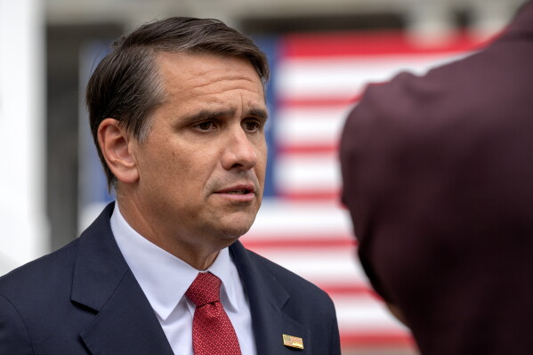 Acting Attorney General Todd Blanche speaks to a reporter outside the White House, Wednesday, May 27, 2026, in Washington. (AP Photo/Mark Schiefelbein)
