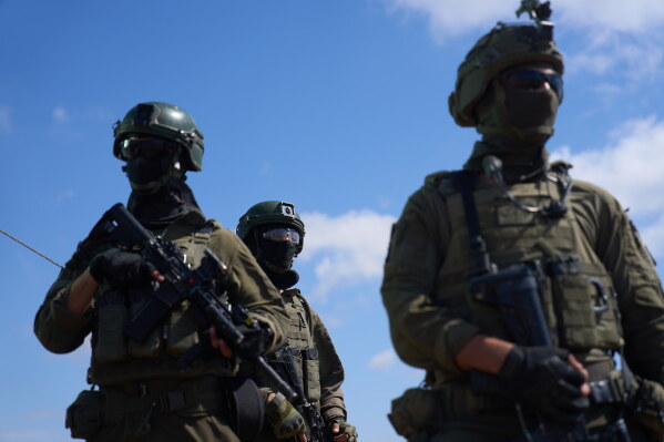 Israeli soldiers occupy a military position overlooking the so-called yellow line in the central Gaza Strip, Tuesday, May 26, 2026. (AP Photo/Ariel Schalit)