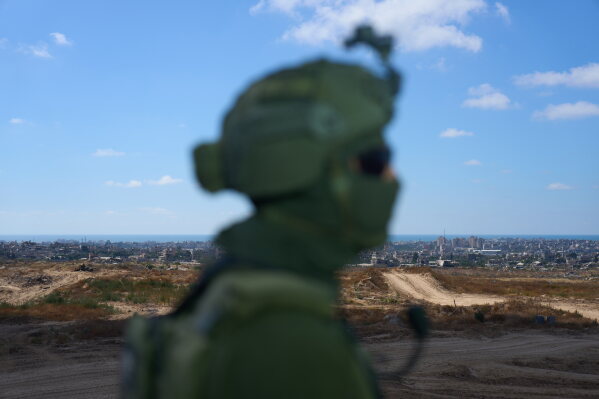 An Israeli soldier occupies a military position overlooking the so-called yellow line in the central Gaza Strip, Tuesday, May 26, 2026. (AP Photo/Ariel Schalit)