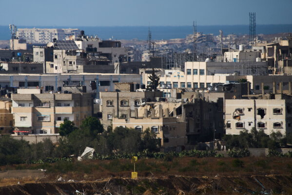 A yellow block stands demarcating the "Yellow Line," which has separated the Gaza Strip's Israeli-held and Palestinian zones since the October ceasefire, is visible in central Gaza Strip, Tuesday, May 26, 2026. (AP Photo/Ariel Schalit)
