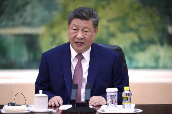 China's President Xi Jinping holds a talk with Russia's Foreign Minister Sergey Lavrov, at the Great Hall of the People in Beijing, China Wednesday, April 15, 2026. (Iori Sagisawa/Pool Photo via AP)
