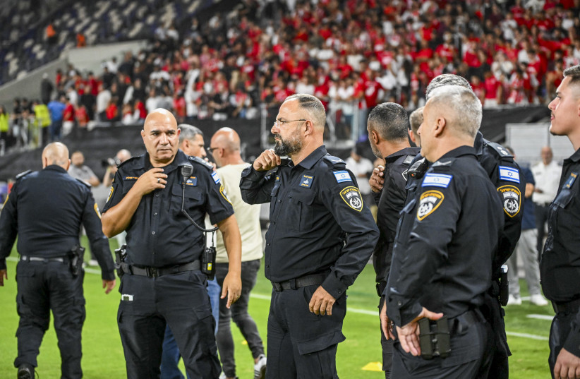 Police stand guard after the Israeli Premier League match between Hapoel Tel Aviv and Maccabi Tel Aviv was canceled at Bloomfield Stadium in Tel Aviv, on October 19, 2025.