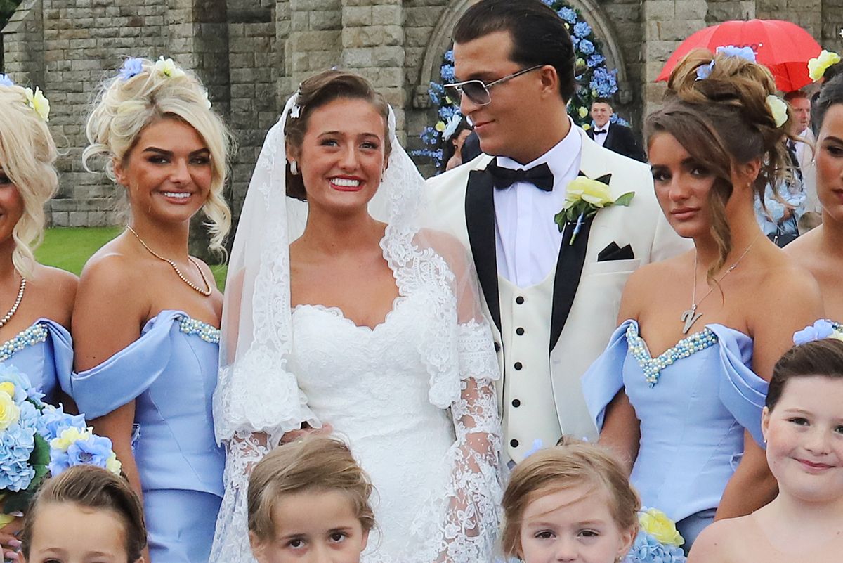 The wedding of Venezuela Fury and Noah Price, with the bridesmaids in blue dresses made by Evangeline Designs