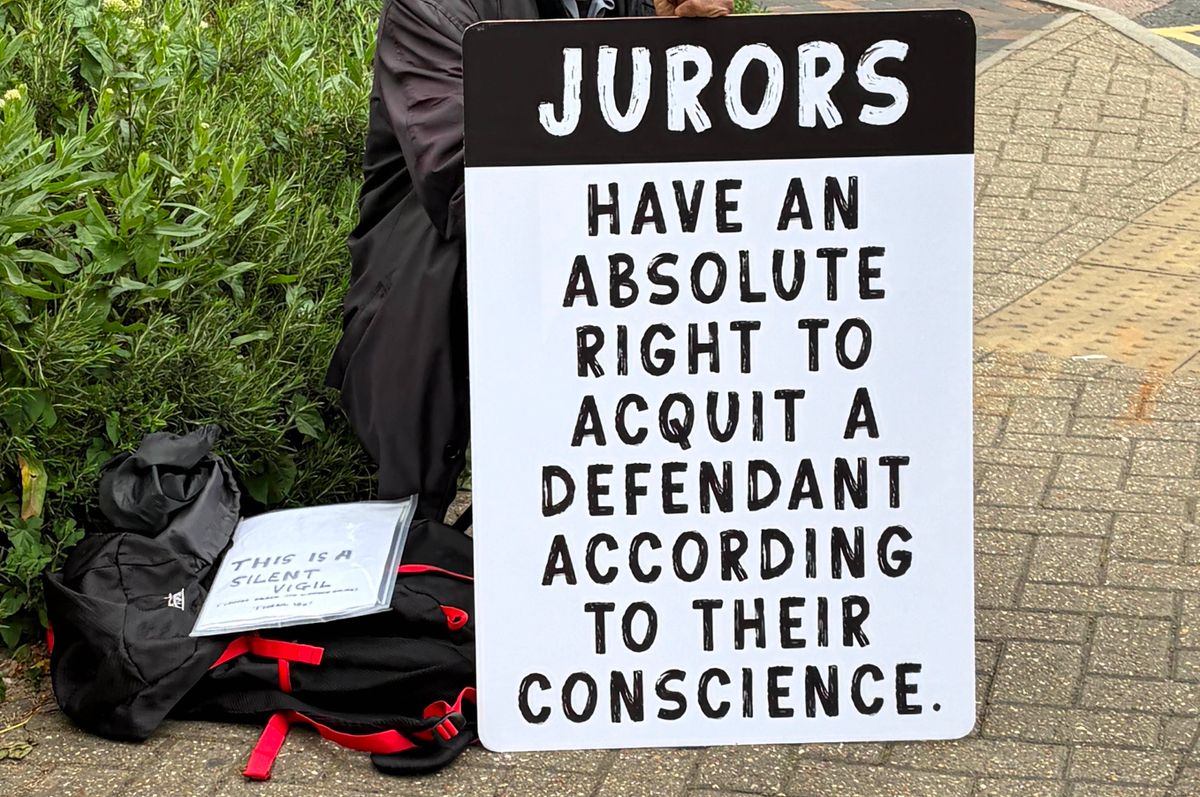 A protester outside Woolwich Crown Court