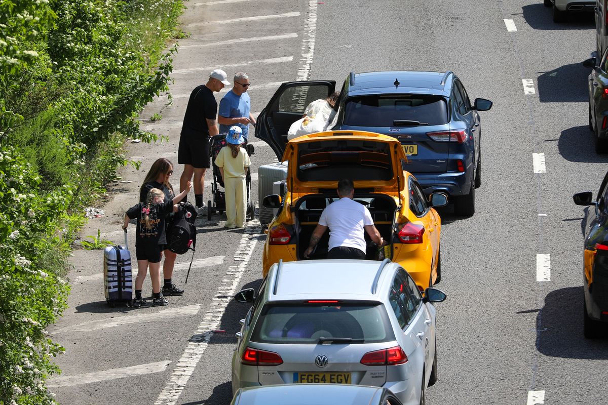 Passengers were seen getting out on the road