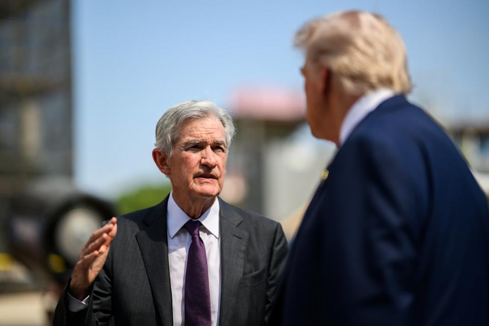 Jerome Powell speaking with Donald Trump in front of the Federal Reserve's headquarters in Washington, D.C.