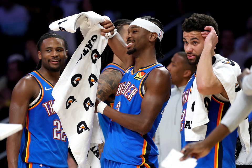 Cason Wallace #22, Shai Gilgeous-Alexander #2 and Ajay Mitchell #25 of the Oklahoma City Thunder celebrate from the bench against the Los Angeles Lakers during the fourth quarter in Game Three of the Second Round of the NBA Western Conference Playoffs at Crypto.com Arena on May 09, 2026