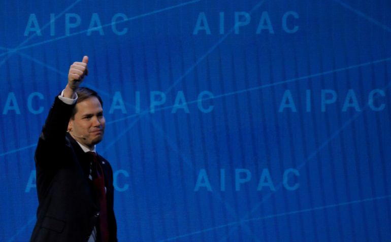 a man walks in front of a blue wall that says apace