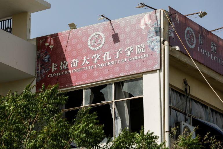 A general view shows broken window glasses, after a blast near a passenger van at the entrance of the Confucius Institute University of Karachi, Pakistan April 26, 2022. REUTERS/Akhtar Soomro