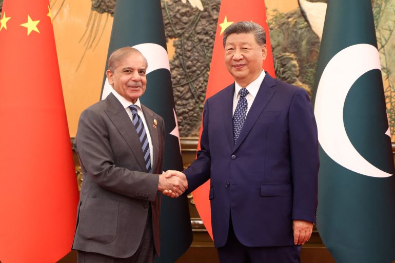 Chinese President Xi Jinping shakes hands with Pakistan Prime Minister Shehbaz Sharif at the Great Hall of the People, in Beijing, China, September 2, 2025. China Daily via REUTERS ATTENTION EDITORS - THIS PICTURE WAS PROVIDED BY A THIRD PARTY. CHINA OUT. NO COMMERCIAL OR EDITORIAL SALES IN CHINA.