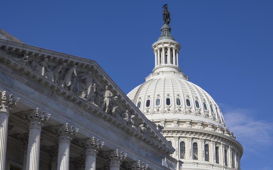 The United States Capitol dome with a blue sky behind it.
