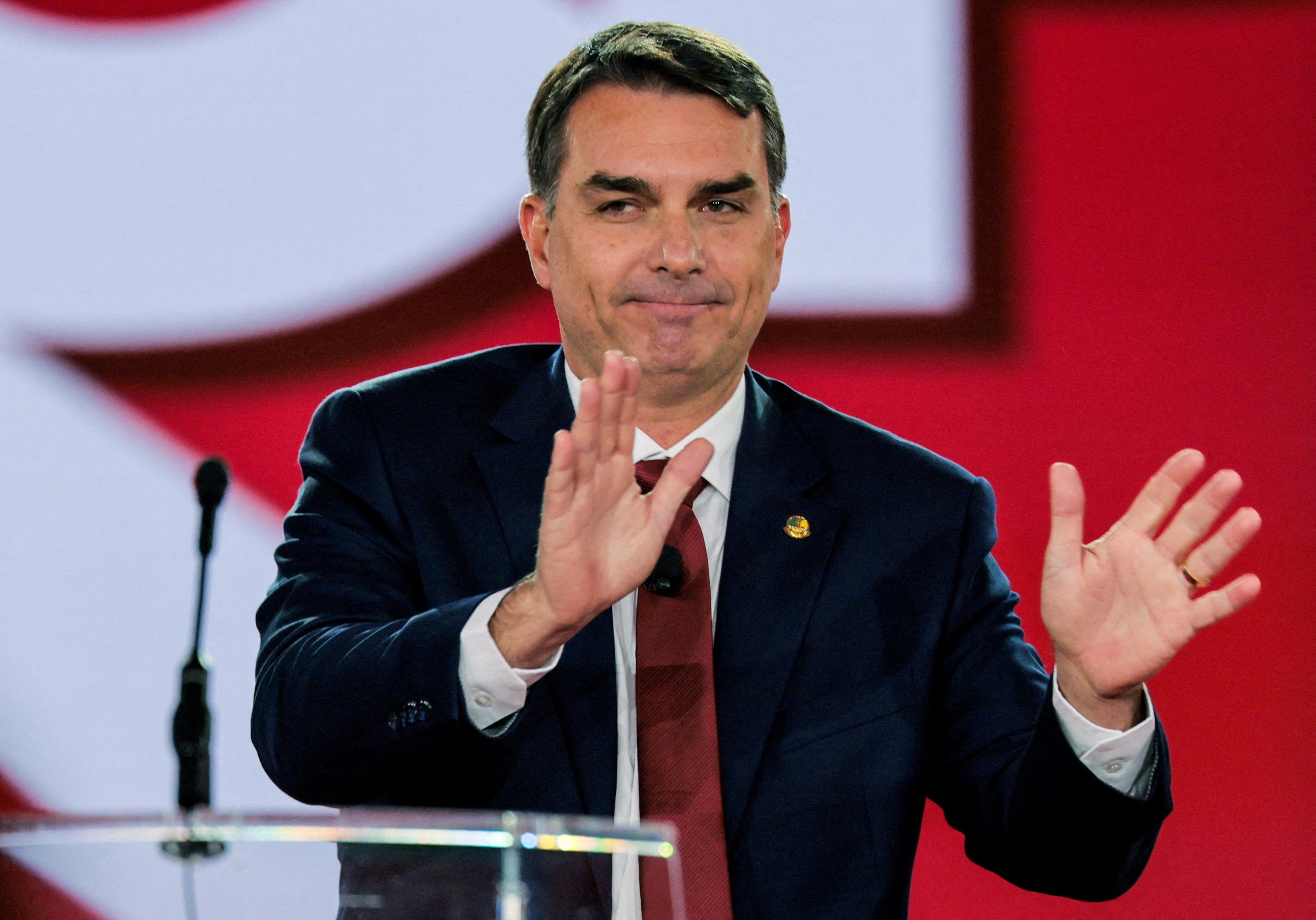 Brazilian senator Flavio Bolsonaro, son of Brazil's imprisoned former President Jair Bolsonaro, will challenge current President Luiz Inacio Lula da Silva in the fall.