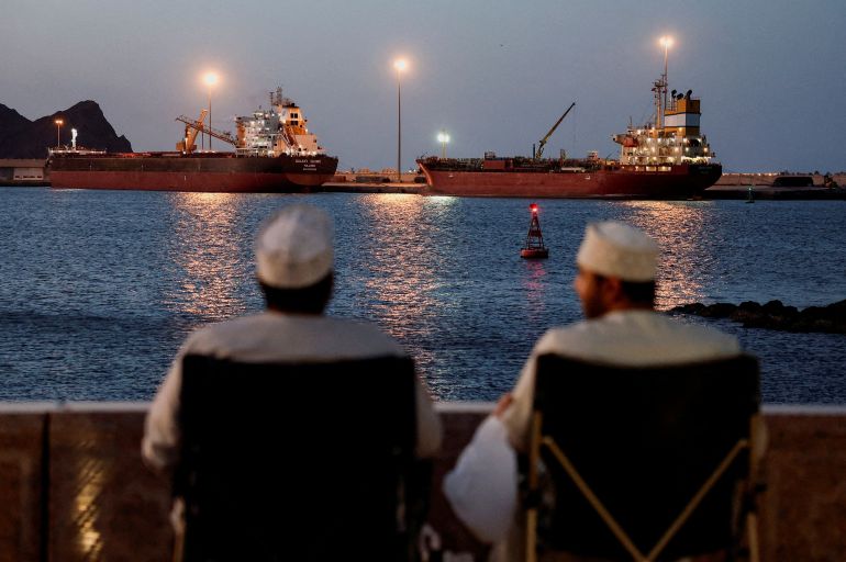 The Galaxy Globe bulk carrier and the Luojiashan tanker sit anchored as Iran vows to close the Strait of Hormuz,