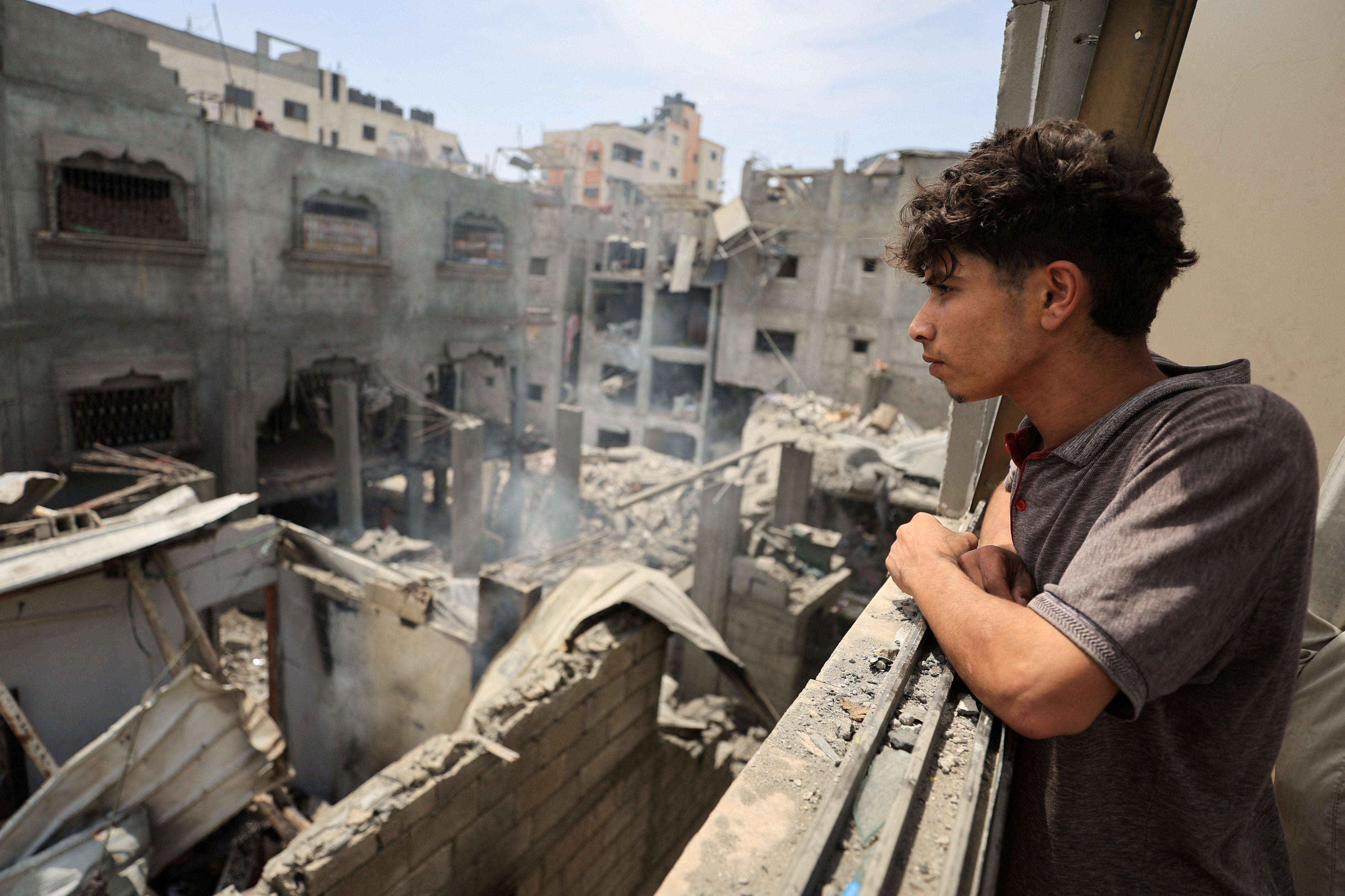 Palestinians inspect the site of a Friday Israeli air strike on houses, at Shati (Beach) refugee camp in Gaza City, May 9, 2026