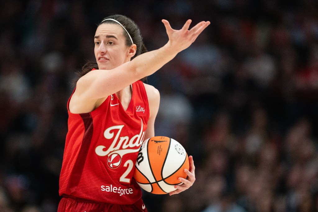 Caitlin Clark of the Indiana Fever reacts to a foul call during a game.