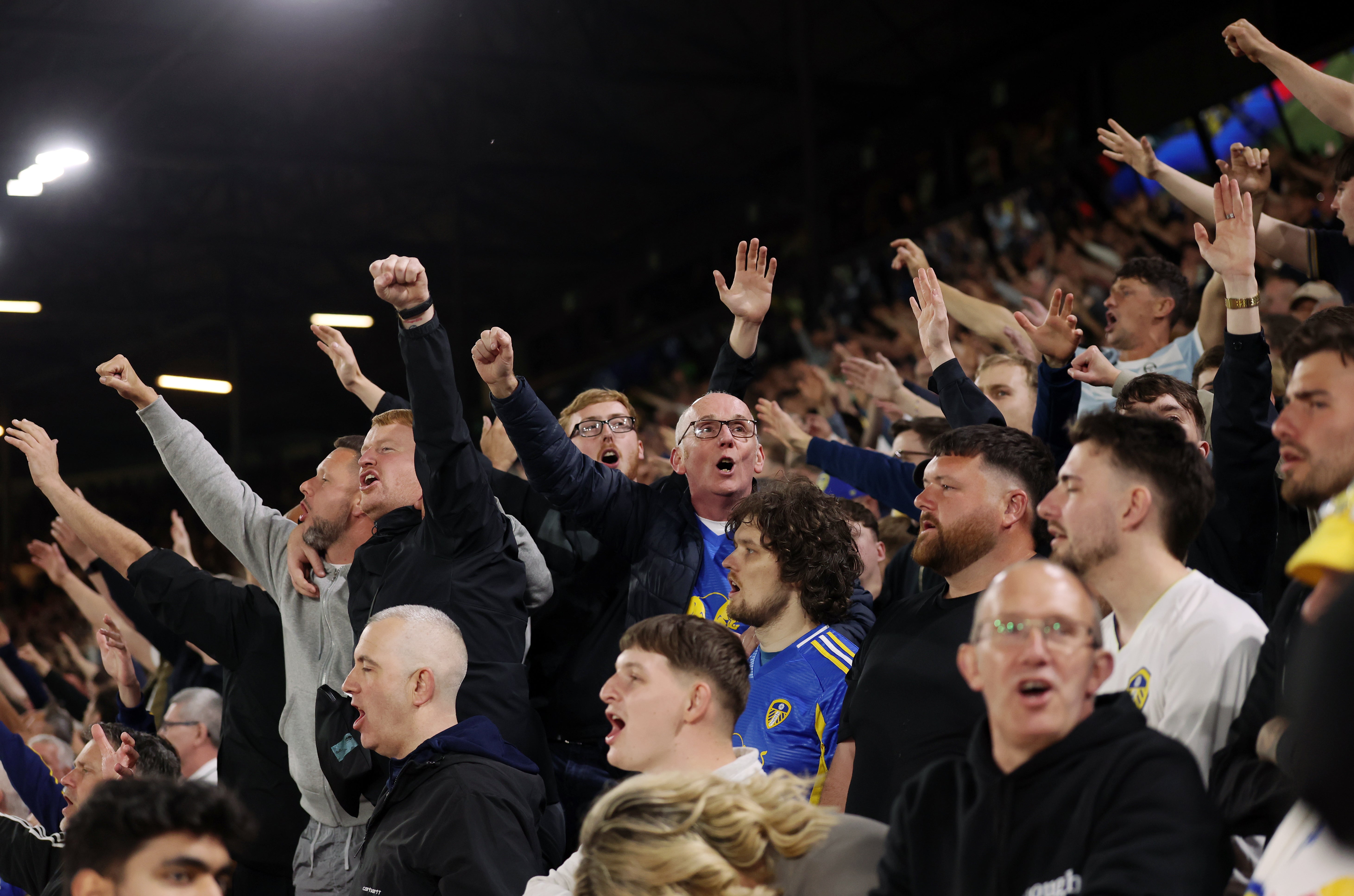 Leeds fans celebrate their third goal of the game