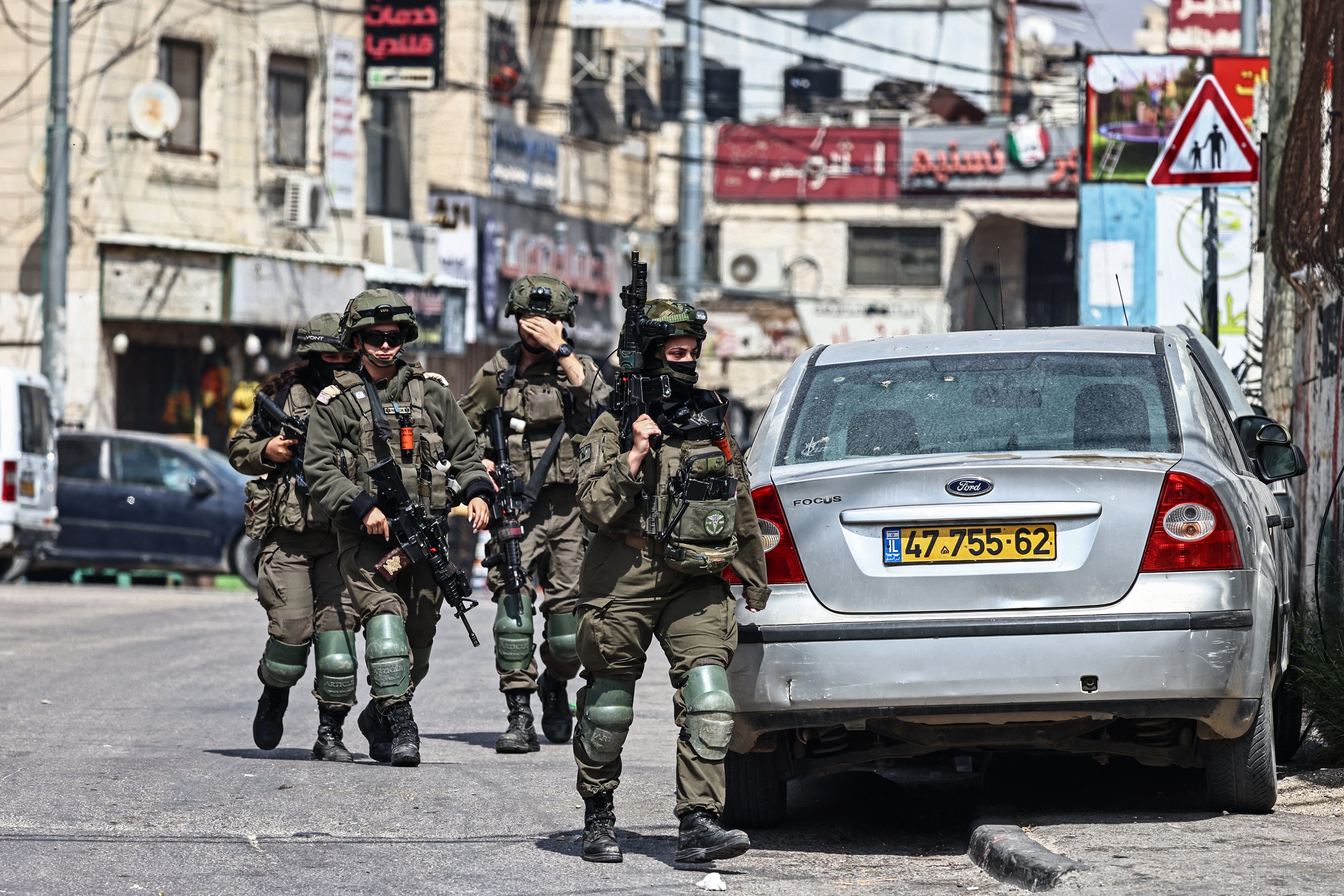Israeli security forces patrol during a military raid at the Qalandia refugee camp, south of the city of Ramallah, in the Israeli-occupied West Bank, on May 6, 2026