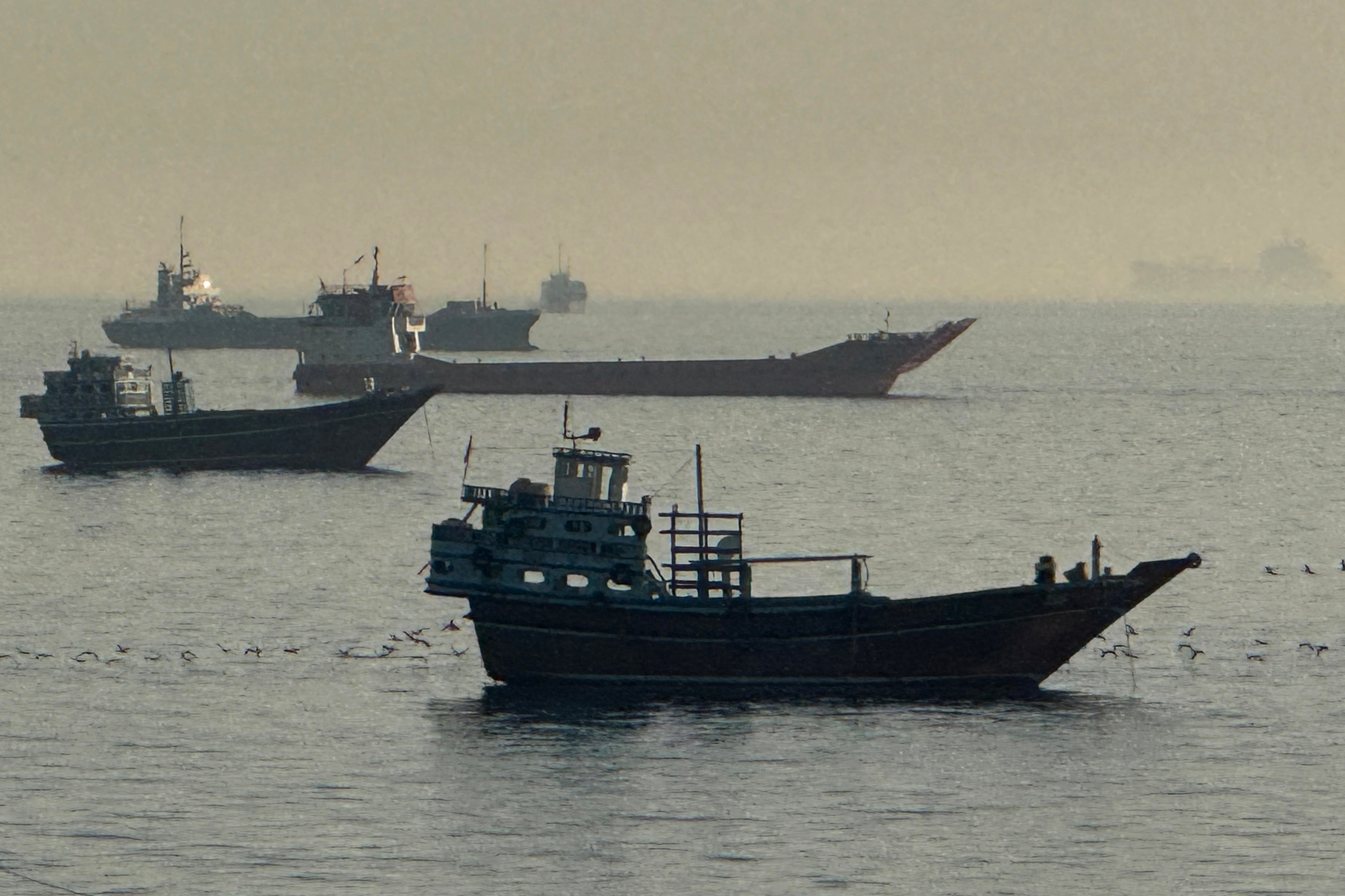 Vessels are seen anchored in the Strait of Hormuz, off the port city of Khasab on Oman's northern Musandam Peninsula on May 17