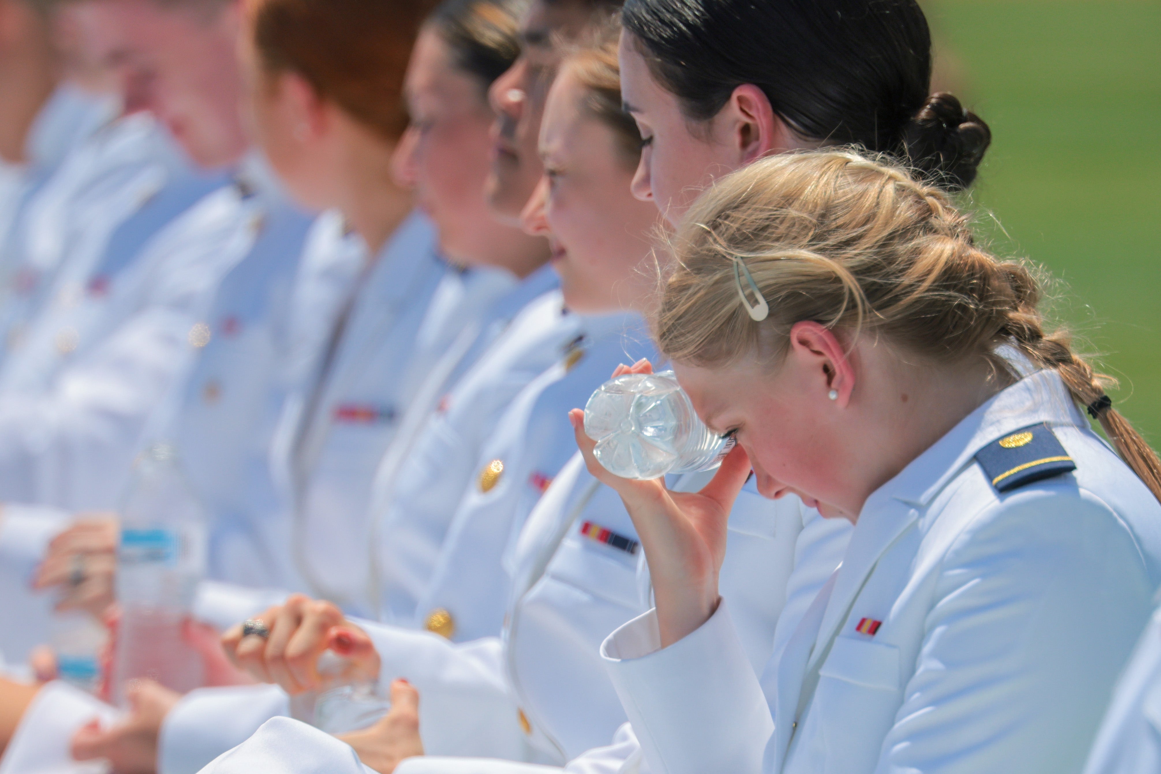 A cadet attempts to stay cool as President Donald Trump delivers the commencement address during the United States Coast Guard Academy commencement ceremony in New London, Connecticut, on Wednesday.