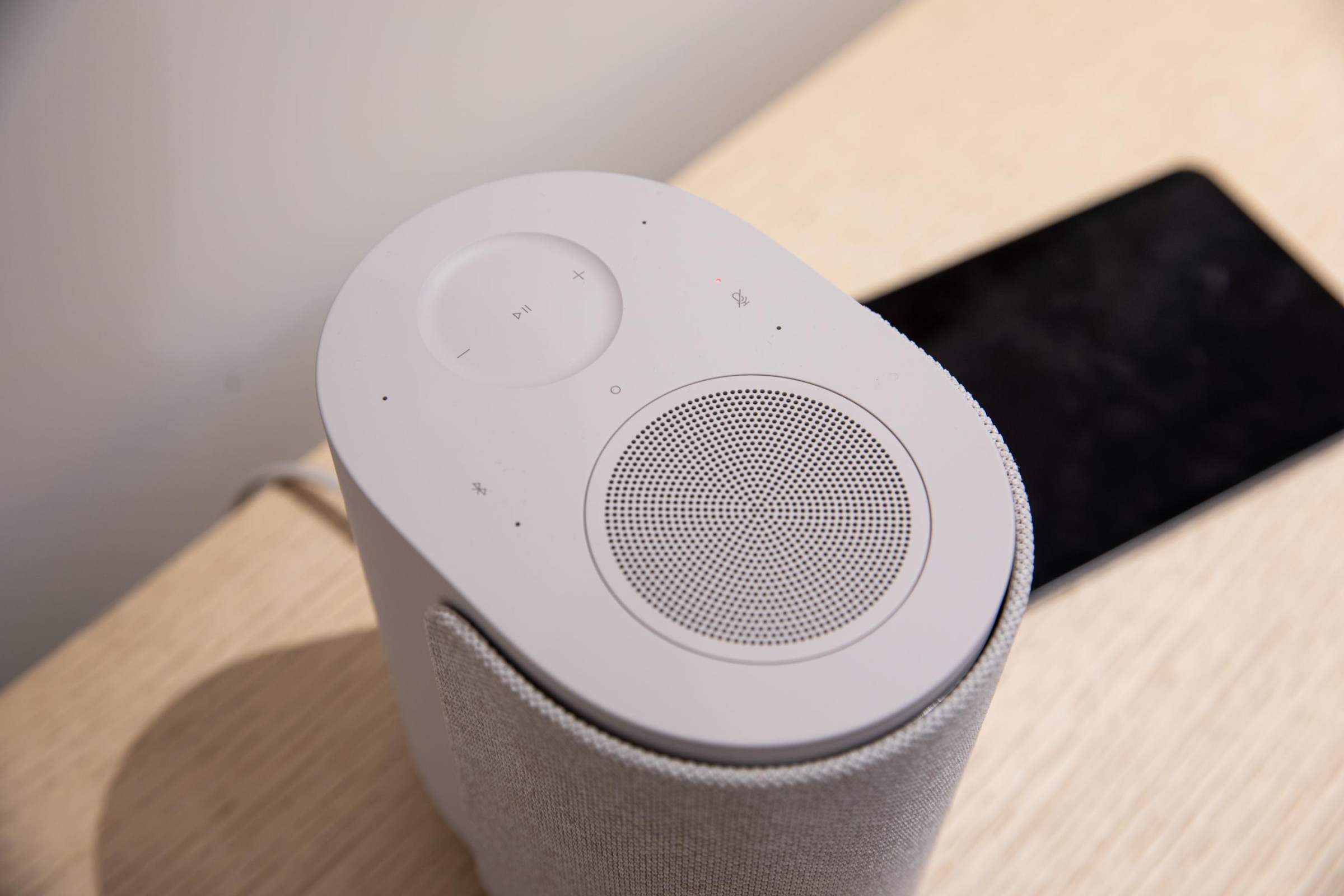 The top of the Bose Ultra Speaker showing its capacitive controls and upward-firing speaker.